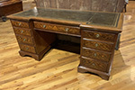 mahogany pedestal desk, tooled leather top, marquetry on front and sides