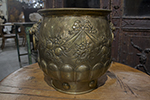 large english victorian brass jardiniere, with floral, ribbon and swag repousse decoration and brass lion