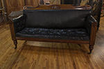 william iv mahogany framed leather sofa with tufted seat, turned legs on casters