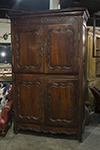 french four-door provincial armoire with brass escutcheons and hinges