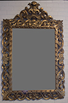 heavily carved gilded mirror