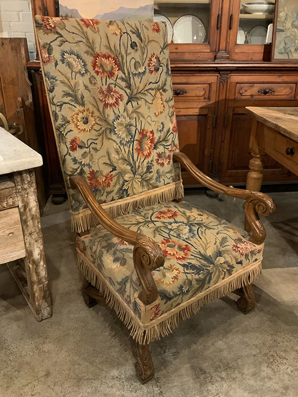 French Needlepoint Begere Chair with Nail Head trim and Fringe Accent.