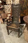 english carved oak armchair in arts and craft style