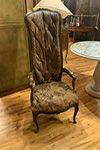 ebonized exaggerated high back louis xv fauteuil with original button leather