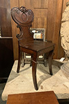 pair of carved english mahogany hall chairs