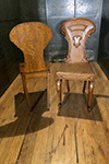 pair of large scottish oak hall chairs with shield backs